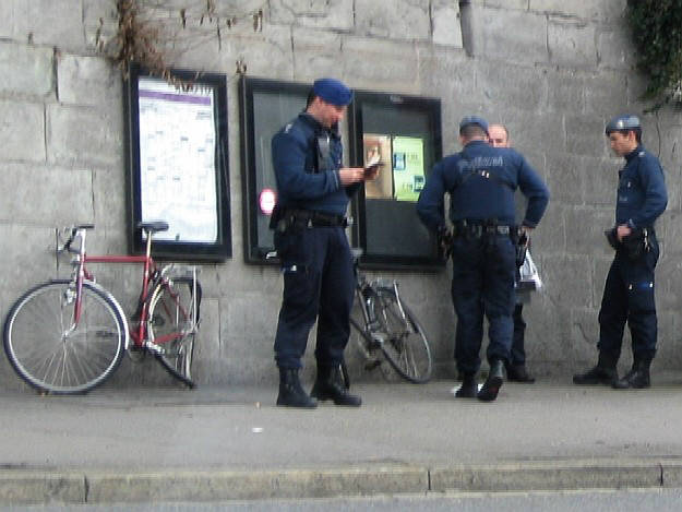zurich switzerland city police hassling a man at central square. stadtpolizei zrich, personenkontrolle am zrcher central.